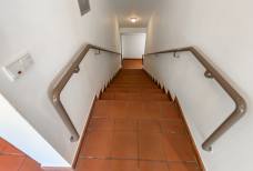 Stairs leading to the toilet in the basement
